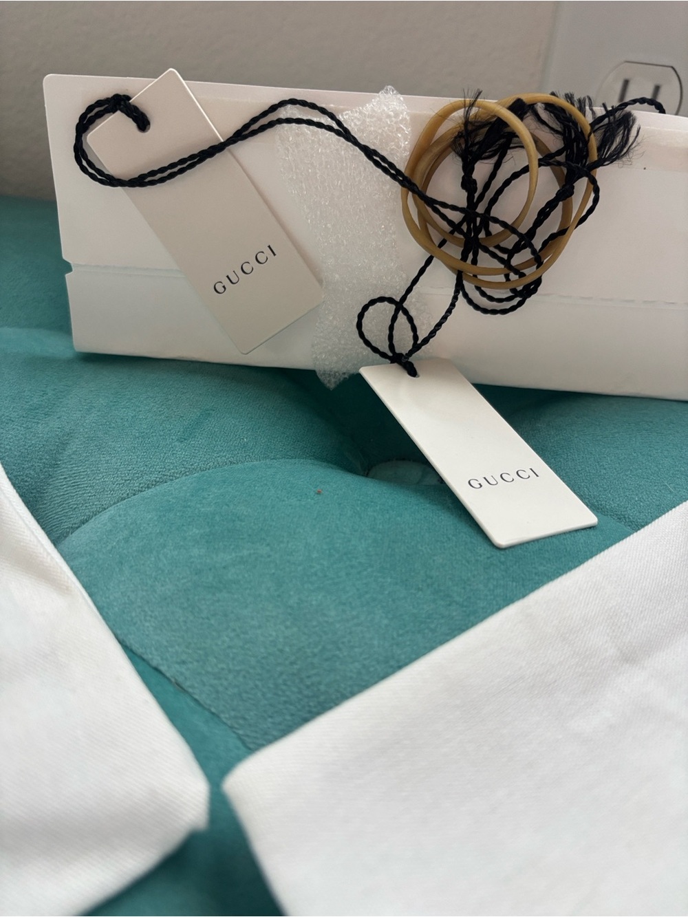 Gucci White Logo Tags with Black Cord and Tan Rubber Bands